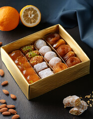 Traditional Cypriot sweets like loukoumi (Cyprus Delight) are presented in a box, representing the island's sweet treats and culinary heritage.