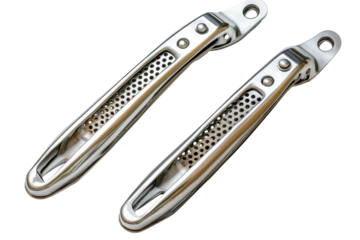 Sleek stainless steel garlic presses kitchen tools modern design perforated detail metallic shine isolated on black
