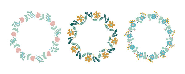 Spring floral circle frame set. Hand drawn botanical wreaths featuring branches, leaves, and flowers. Vector isolated illustrations perfect for wedding invitations, cards, and logos.