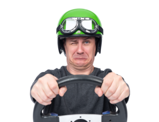 Scared man wearing a green helmet and goggles tightly gripping a steering wheel. Isolated on a transparent background PNG. Concept of fear, driving stress, or emotional reaction.