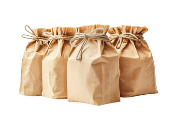 Obraz premium Three rustic brown paper bags tied with twine on a black background simple on transparent background