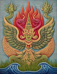 Obraz premium Detailed Mythical Garuda Illustration in Red Gold with Spread Wings Over Blue Waves