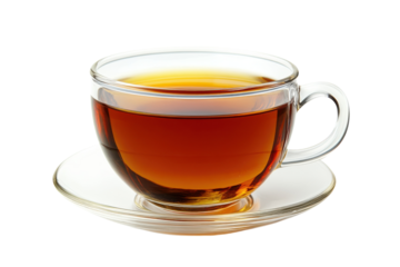 Warm amber tea in a clear glass cup resting on a saucer against a black background Rich inviting brew
