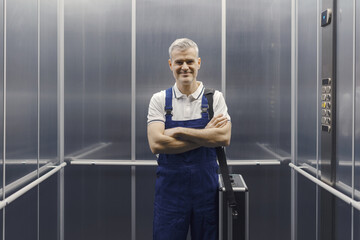 Technician standing in the elevator © stokkete