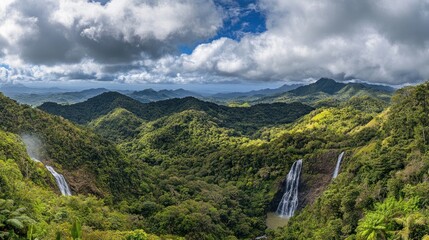 Majestic landscape featuring lush green mountains and several waterfalls