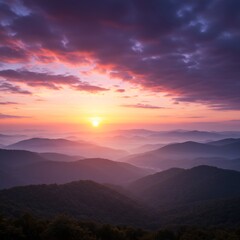 Fototapeta premium A mesmerizing sunset painting the sky above rolling mountains. The vibrant colors create a stunning and awe-inspiring vista