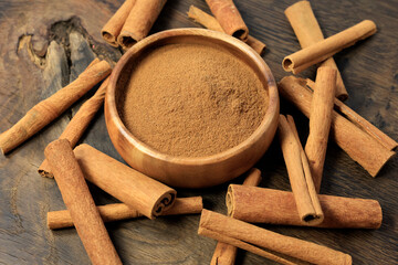 cinnamon sticks and cinnamon on the rustic wooden