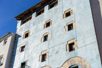 Obraz premium Blue Facade Among Traditional Houses in Cuenca, Spain