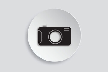 Flat black camera icon on white circular background, representing photography or media.