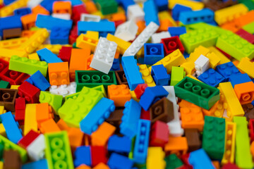 Close-up of a cluttered pile of colorful toy block bricks