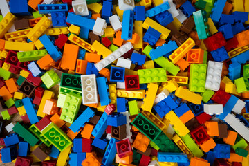 Close-up of a cluttered pile of colorful toy block bricks