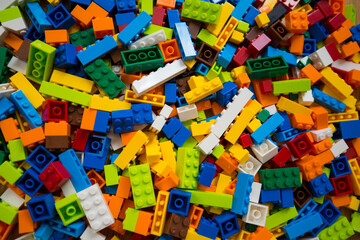 Close-up of a cluttered pile of colorful toy block bricks