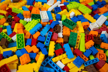 Close-up of a cluttered pile of colorful toy block bricks
