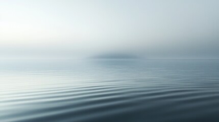 Serene view of the sea with gentle waves on a foggy day