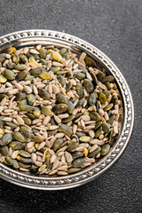 Seed mix pumpkin seeds, sunflower seeds superfood natural food dish organic fresh tasty gourmet food background on the table rustic food top view copy space vegetarian vegan food keto paleo diet