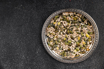 Seed mix pumpkin seeds, sunflower seeds superfood natural food dish organic fresh tasty gourmet food background on the table rustic food top view copy space vegetarian vegan food keto paleo diet