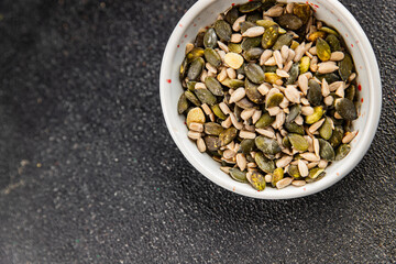Seed mix pumpkin seeds, sunflower seeds superfood natural food dish organic fresh tasty gourmet food background on the table rustic food top view copy space vegetarian vegan food keto paleo diet