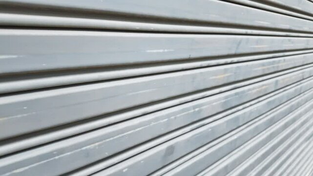 Exterior old metallic roller shutter door background
