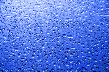 Water drops on blue glass	