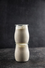 Skyr white yogurt appetizer dish fresh delicious gourmet food background on table rustic food top view copy space keto and paleo diet vegetarian food