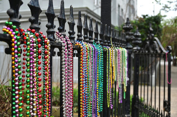 Mardi Gras beads hanging on a fence in New Orleans © MargJohnsonVA