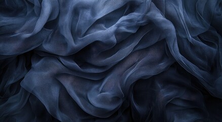 Fototapeta premium A close-up view of deep indigo sheer fabric with flowing drapes.