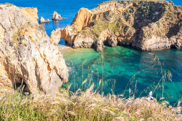 Beach and rugged coastline, photographed in Algarve region of Portugal