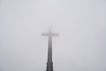 Majestic Valley of the Fallen with Cross Shrouded in Fog