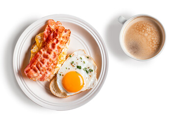 Breakfast sandwiches with fried egg, bacon and coffee isolated