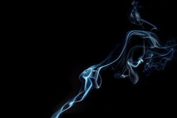 Blue smoke swirls in abstract form, photography style on black background. Concept of mystery and creativity. Swirling, writhing smoke to overlay on your photos