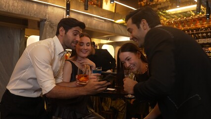 Circle of friends or couple standing fronted bar making selfie smiling with cocktail in Paloma, Margarita, Old fashioned and Martini while bartender making special party night at nightclub. Vinosity.