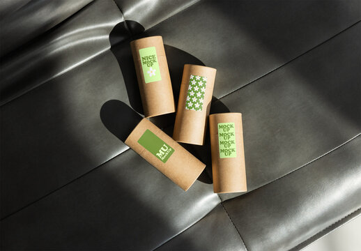 Four pieces of circular packaging sit ready for label customization. PSD mockup