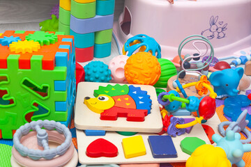 Children's educational toys on a play mat.