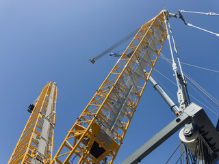 Construction cranes. View from below. Crane used to construct palaces, houses or buildings....
