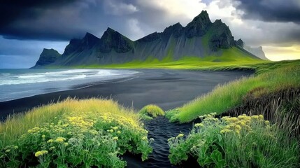 Scenic landscape featuring mountains a beach and some greenery