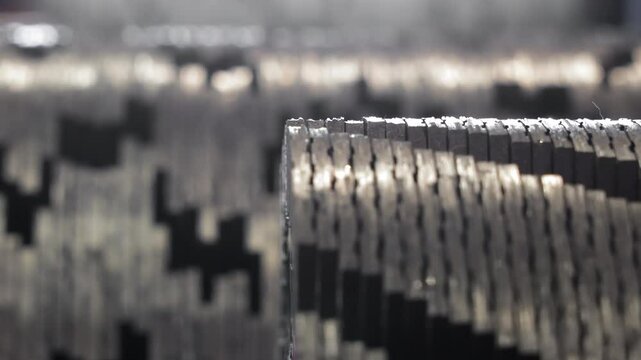 Close-up view of interlocking metal cutting teeth arranged in staggered pattern, Industrial steel shredder blades aligned for heavy-duty mechanical processing