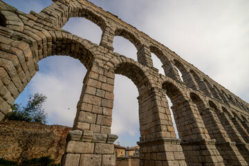 Upside View of Segovia Aqueduct under Partially Cloudy Sky
