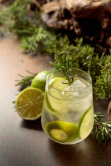 Refreshing hard seltzer with ice, lime, and rosemary.