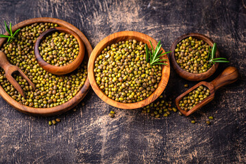 Raw uncooked mung beans on black background