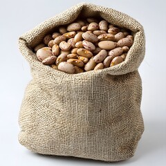 Burlap sack filled with pinto beans in macro studio shot highlighting rustic texture and organic appeal