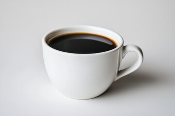 A white ceramic coffee cup filled with black coffee, placed on a plain background, perfect for morning refreshment imagery.