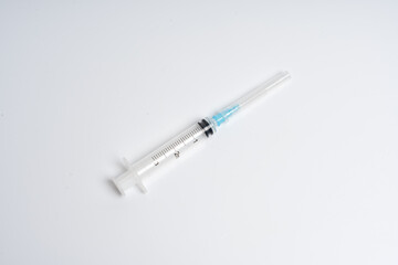 Medical syringe with needle isolated on white background