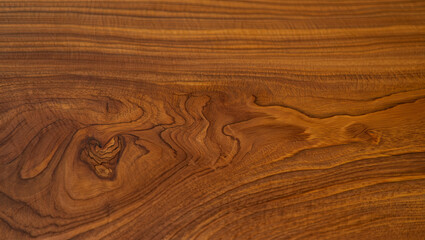 Obraz premium A close-up view reveals the intricate patterns and textures of a warm-toned wooden surface, highlighting natural grains and knots that enhance its beauty and character
