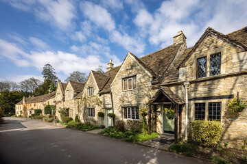A row of Cotswold stone cottages in Castle Combe, Wiltshire, England, Uk