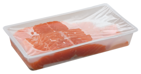 Slices of raw salmon fillets are packaged in a clear plastic tray, sealed with transparent film. Isolated background