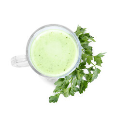 Healthy parsley drink in glass and leaves isolated on white, top view