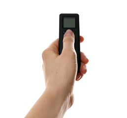 Woman with air conditioner remote control on white background, closeup