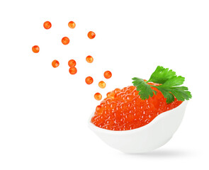 Red caviar falling into bowl on white background. Salmon roe