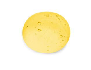 Drop of golden serum on white background
