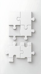 Fototapeta premium White puzzle pieces arranged on a white surface